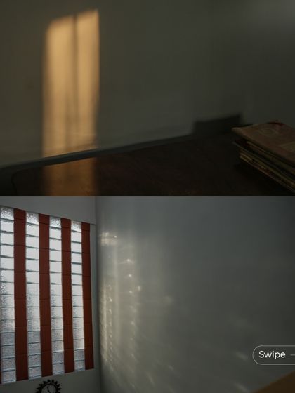 The play of natural light inside the Shashidhar Residence, with soft sunlight filtering through windows and creating a peaceful ambiance.