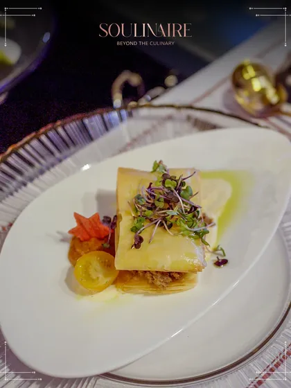 A delicate phyllo pastry bite, showcasing intricate layers and a savory filling. Our appetizers are crafted to be both visually appealing and delicious.