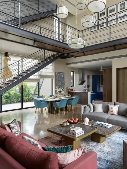 Another angle of the double-height living space, showing how the open layout creates a visual connection between the ground floor and the upper level, fostering a sense of togetherness for the family.