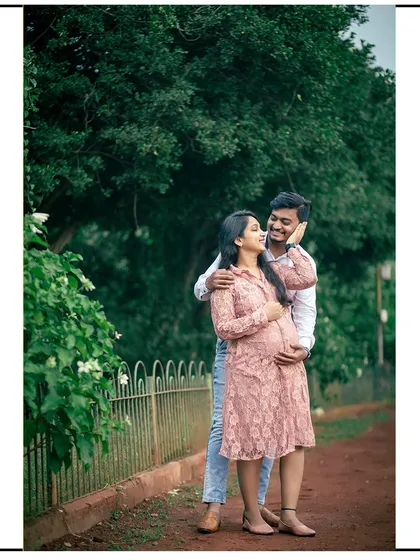 A happy, candid moment of a couple enjoying a walk together in the park.
