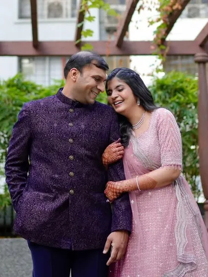 A sweet couple's portrait from their engagement. The bride's makeup is soft and pretty, designed to enhance her features without looking heavy.