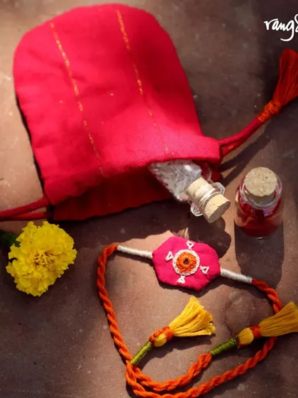 A handmade and heartfelt Rakhi, complete with a small potli bag. This gift set is a simple yet meaningful way to celebrate the bond you cherish most.