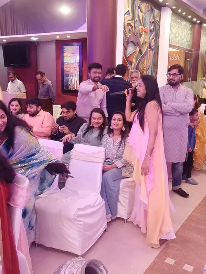 Interacting with guests during a ring ceremony. I move around the venue to ensure everyone feels included and part of the fun.