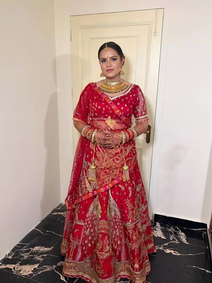 A full shot of the bride, showcasing her entire stunning ensemble and the makeup that ties it all together.