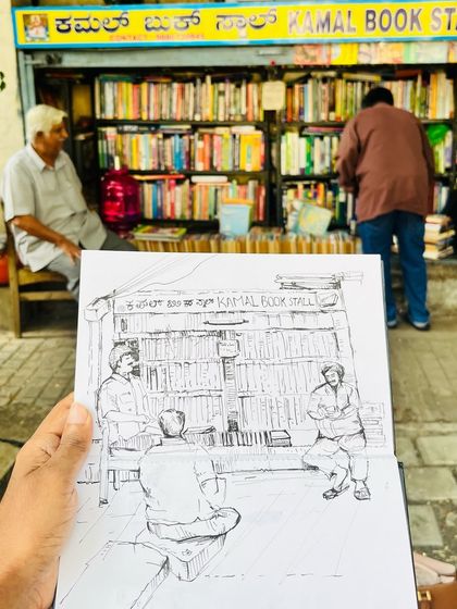 My finished sketch held up against the real Kamal Book Stall. It's a little slice of old Bangalore.