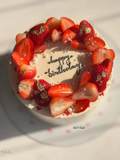 A seasonal favorite, this Vanilla Strawberry cake is topped with fresh strawberries, edible gold leaf, and tiny sugar pearls. It's available as a celebration cake or a smaller bento cake.
