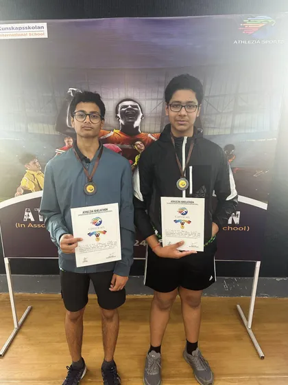 Two of our academy players proudly displaying their bronze medals and certificates after a hard-fought Inter-School tournament. Their dedication to training really shows.