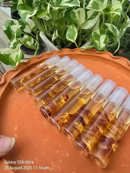 A row of my Lip Serum Oils, each filled with natural oils and delicate petals to heal and protect your lips.
