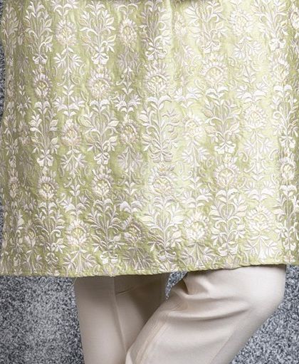 A final detail shot of the embroidered hem of our mint green kurta.