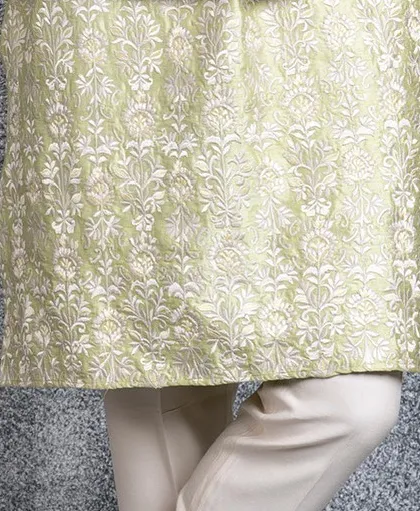 A final detail shot of the embroidered hem of our mint green kurta.