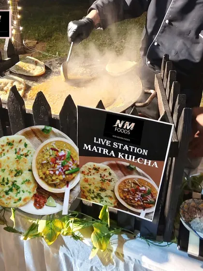 A taste of authentic Delhi street food, made live at your event. This is our Matra Kulcha station, where soft, fluffy kulchas are served hot off the tawa with flavorful matra, bringing a rustic and beloved culinary experience to your celebration.