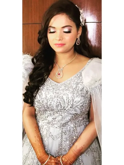 A close-up of the Roka makeup. The silver cut-crease eyeshadow and soft pink lip create a look that is both modern and romantic.