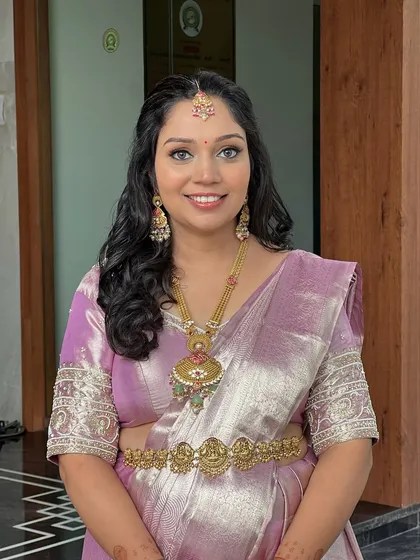 Another angle of this soft and elegant baby shower look, focusing on the flawless makeup.