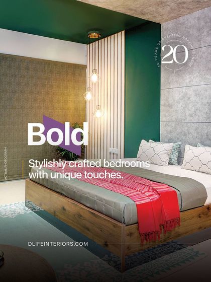 This bold bedroom design uses a dark green accent wall and a pop of red to create a stylishly crafted space with a unique touch.