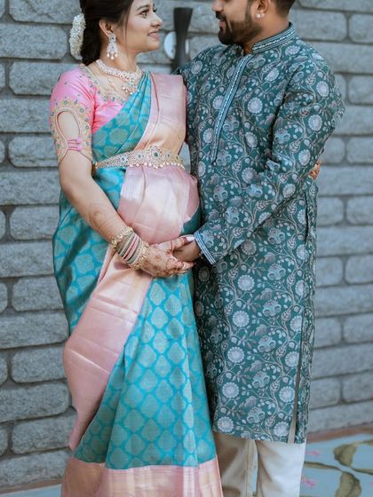 A lovely photo with her husband. Our sarees are for celebrating family milestones together.