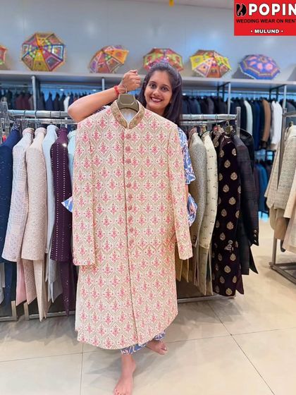 This light pink and ivory patterned sherwani is a great choice for a day wedding or a pre-wedding function. The subtle colors and elegant pattern offer a fresh, modern take on traditional wear.