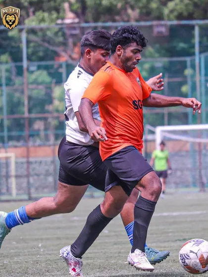 A throwback to our MFA First Division campaign, showing a player shielding the ball under pressure.