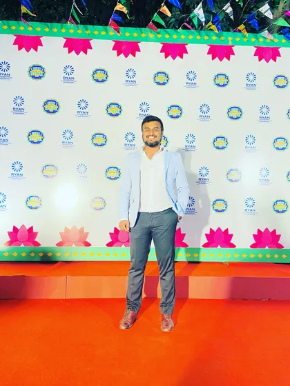 Posing on the red carpet at the Ryan Festival. I take pride in being a part of such well organized and grand school events.