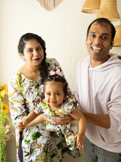 A playful family portrait that captures the energy and happiness of the moment. My goal is to create a relaxed environment where families can be themselves, resulting in authentic photographs.