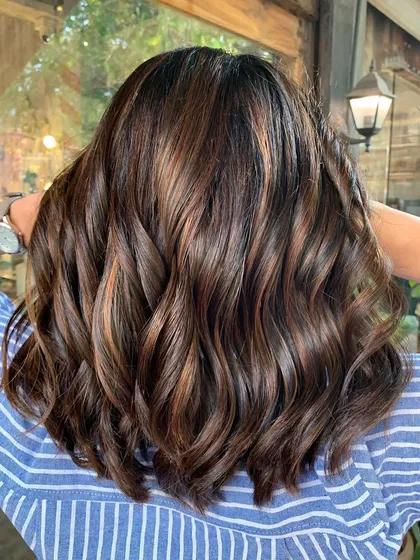 Another angle of this makeover, showing how the cut and color work together to create a whole new look.