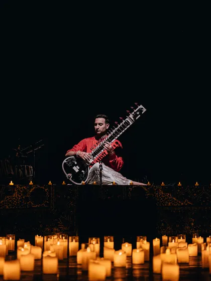 Surrounded by a sea of candles in Ahmedabad. This visual is central to my shows, symbolizing the light we aim to cultivate within ourselves and share with the world.