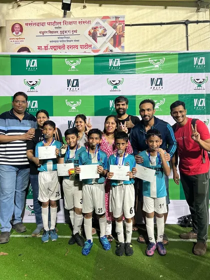 The U-10 team with their coaches and proud parents after their final match at the Grassroots Cup.