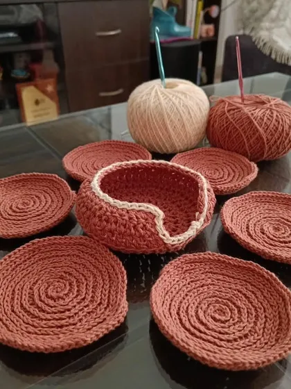 This is my handmade coaster set, made with high quality cotton yarn. It comes with six coasters and a little basket to keep them in. This rustic brown color looks very nice on the table. 😇