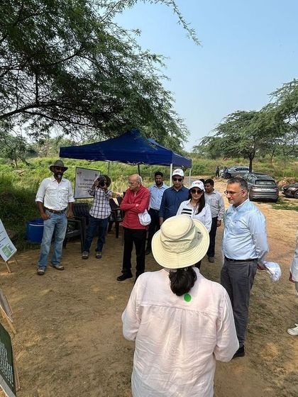The Bry-Air team and children from local Pathshalas listen to a briefing at Aravali Nagar Van, learning about the importance of native species.