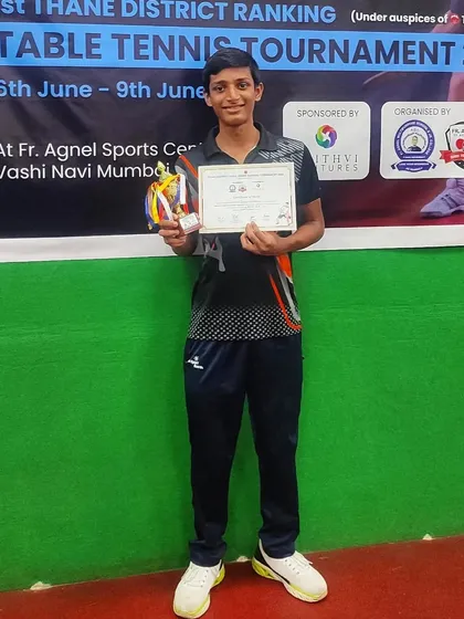 Johan Cheriparambil with his certificate and medals after securing third place in the U-15 boys' category at the District Ranking Tournament.