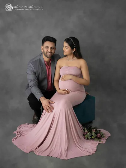 The connection between a couple during this time is so special. This pose captures that intimacy and shared joy, creating a memory of the moments just before you became three.
