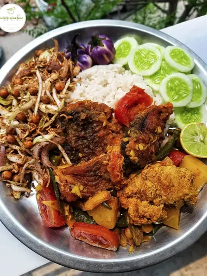 A simple fried fish curry plate, served with singju salad and fresh vegetables.