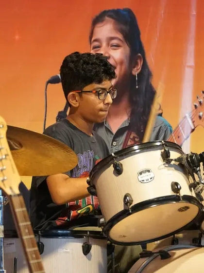 A young drummer lays down the beat at the Chembur showcase. Even at our center-level events, we provide a full backline so students can experience playing with proper equipment.