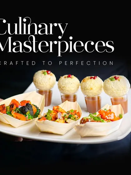Culinary masterpieces crafted to perfection. This platter features delicate pani puri shots and savory bites in bamboo boats, showcasing our innovative approach to appetizer presentation.