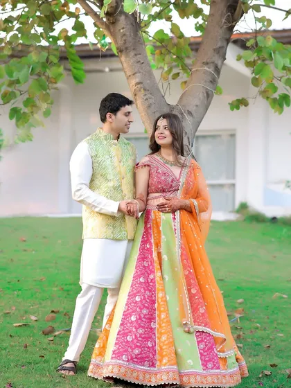 A celebration of vibrant love and color. This outdoor shoot shows how I play with bright, traditional outfits against a lush green background to create images that are full of life, joy, and cultural richness.