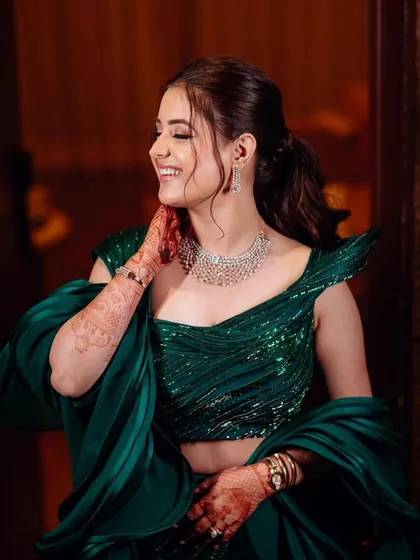 The bride's joyful smile says it all. This candid shot captures the happiness and confidence that comes with wearing a perfectly styled outfit.