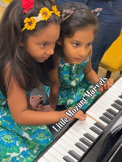 Our 'Little Mozarts' exploring the piano. We believe it's never too early to start a musical journey, and our classes for young children are designed to be fun, engaging, and inspiring.