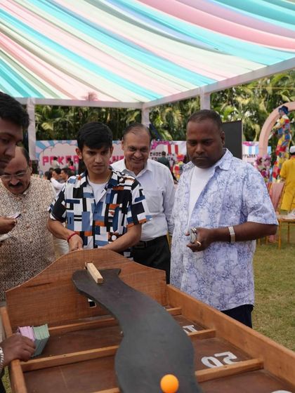 Carnival of hearts. Guests enjoying one of the many traditional games set up for the daytime festivities.