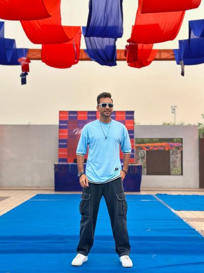 Posing before the start of a sports-themed event. I can help you organize a full day of activities for your team, complete with a fun and energetic hosting style to keep everyone motivated.