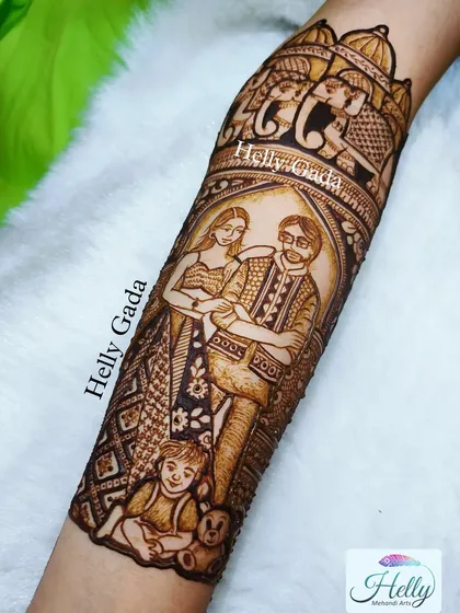 Here is the final, detailed look at the family portrait on the arm. The shading and line work bring the figures to life, framed by traditional elephant and architectural motifs.