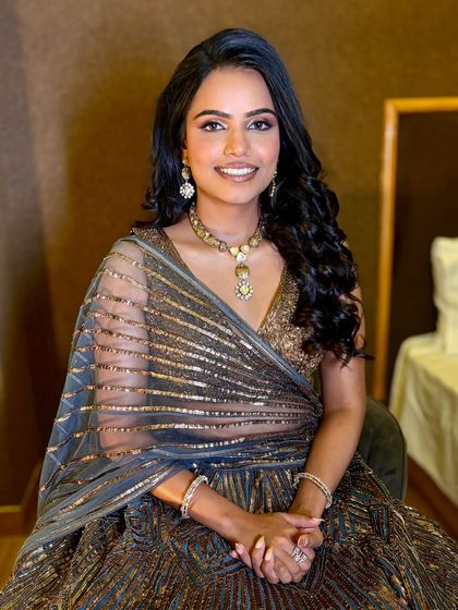 A portrait of Niharika, showing her stunning engagement look. The makeup is warm and glowing, perfect for her skin tone.