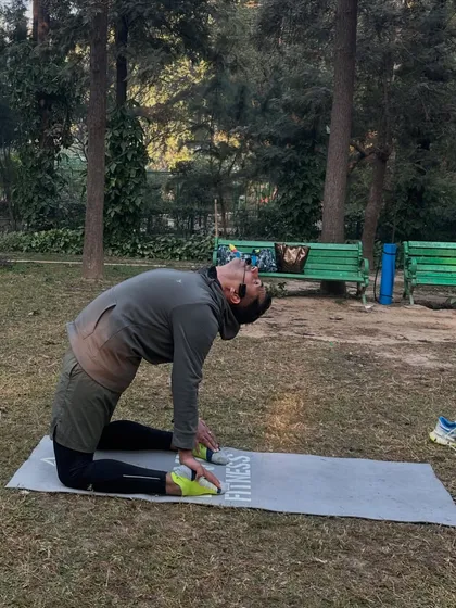 The camel pose, an excellent stretch for the hip flexors and chest, which get tight from running.