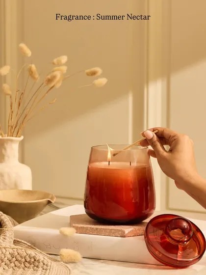My spring-summer collection is a crowd-favorite, and this Cosmic Hue candle with our Citrusy Summer Nectar fragrance is a perfect example. It's designed to spark a new spirit and purpose into your life.