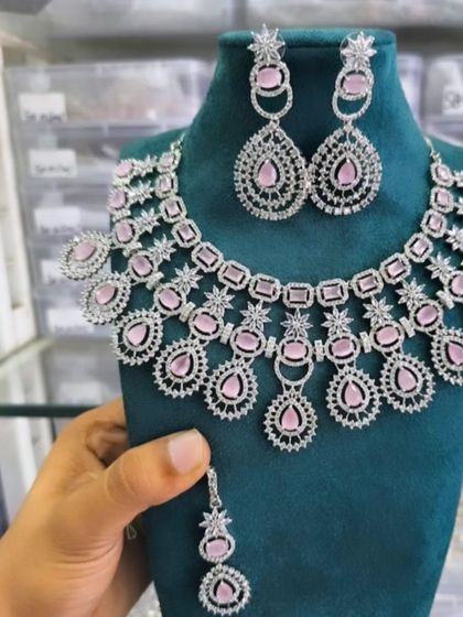 A modern American Diamond necklace set with beautiful pink stones, perfect for a party or engagement.