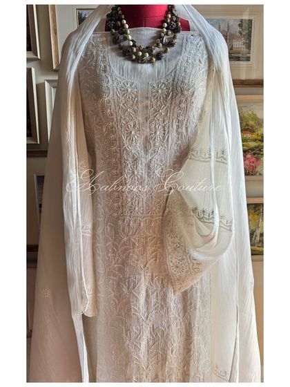 A straight-on mannequin shot, offering a clear and complete view of this timeless Chikankari suit.