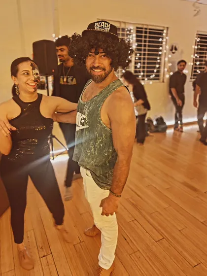 Our co-founder Sai rocking a wig and joining in on the Halloween fun with a student. We take our goofing around very seriously.