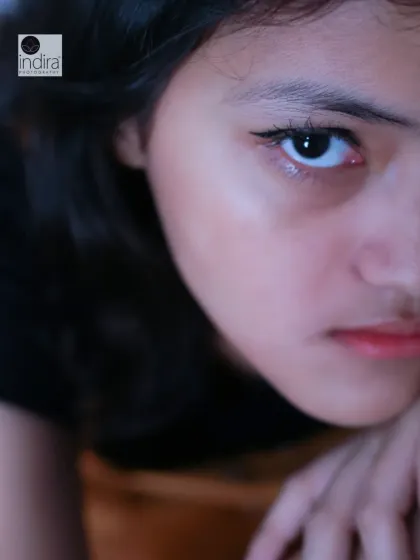 This is what I mean by capturing moods. This intense, close-up portrait from a teenage photoshoot reveals a story in her eyes. I create a comfortable space where teens can be themselves, allowing me to capture their true personality, whether it's quiet, bold, or somewhere in between.