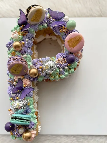 A letter "P" cake I made for the designer Papa Don't Preach. The design is inspired by their vibrant and playful aesthetic, with disco balls, macarons, and butterflies.