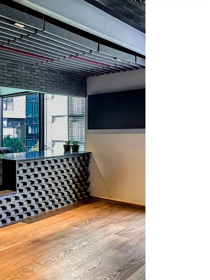 A detail of the textured brickwork at the reception counter in BCG HQ, showcasing the craftsmanship and attention to detail in our commercial interior projects.
