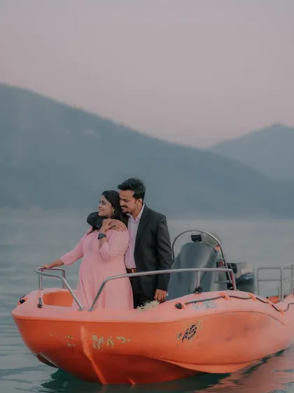 A romantic pre-wedding shoot on a boat, set against the tranquil hills of Tehri. We love using beautiful landscapes to create a serene and intimate atmosphere for our couples.