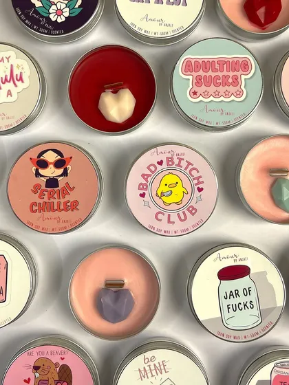 We also create fun, quirky candles for brands. This bulk order features our tin candles with witty and trendy labels like 'Adulting Sucks' and 'Serial Chiller', perfect for a youthful brand.